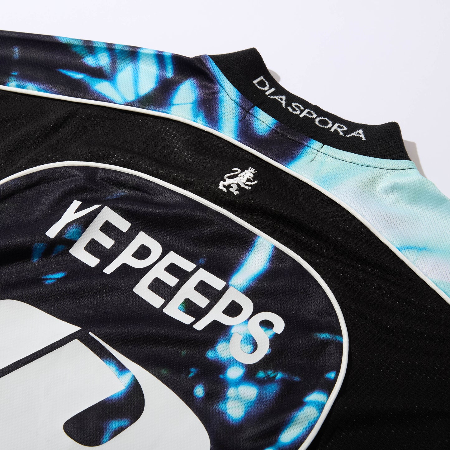 DIASPORA SKATEBOARDS/YE PEEPS Football Top