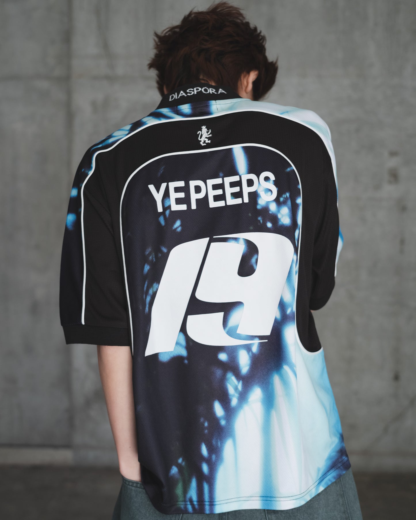 DIASPORA SKATEBOARDS/YE PEEPS Football Top