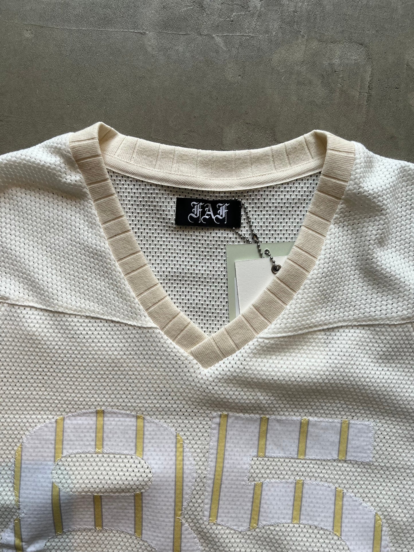 FAKE AS FLOWERS/Stripe Football Jersey