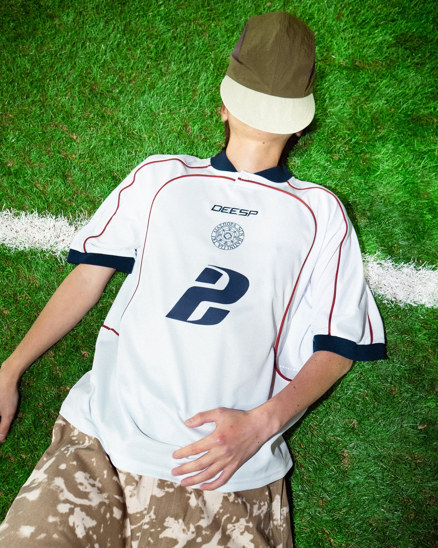 DIASPORA SKATEBOARDS/YE PEEPS Football Top